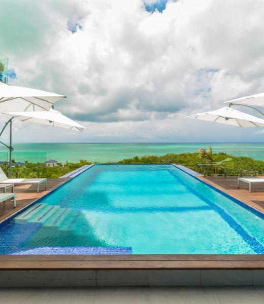 Built to capture incredible ocean views, Villa Skyline is a modern paradise, just five minutes from the beach. Located in Turks and Caicos, on the western edge of Grace Bay, Villa Skyline is perfect for a family getaway, couples retreat, or even a romantic, island honeymoon with a little extra space. Nearby, you’ll find duty-free shopping,...