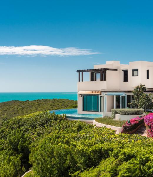 Bajacu is a truly amazing six bedroom Turks and Caicos villa surrounded by an 11 acre estate of lush tropical gardens with coconut, royal palm, fruit trees, bougainvilleas, jasmine, and frangipani. Bajacu is perched on a hilltop and offers direct access to the sea. One of the highlights of this gorgeous Turks and Caicos villa is the layout of two...