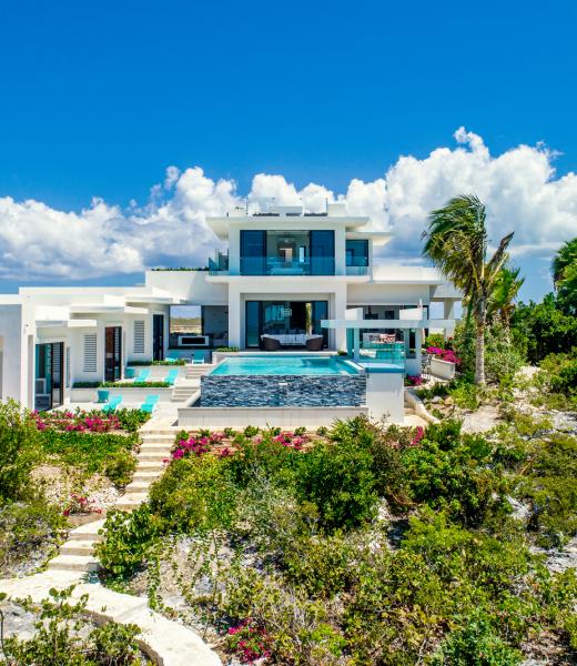 Sandy Bottom is a Turks and Caicos villa rental that overlooks the turquoise bay of Caicos. Sandy Botton was designed by local architect Ron Shaw and was inspired by Frank Lloyd Wright. The villa is powered completely by solar panels, the first villa on 'Provo' to adopt renewable energy. 
This Turks and Caicos villa, Sandy Bottom, has amazing...