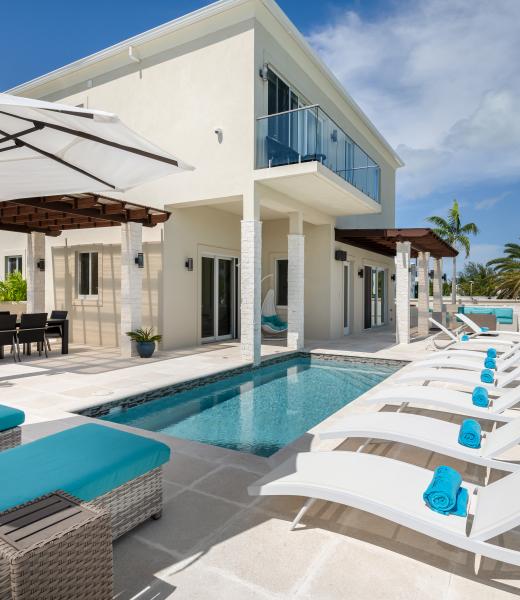 Sugar Apple is a lovely vacation rental in Turks and Caicos. This villa is breathtaking and sits in the Kira Island cul de sac. This four-bedroom Turks and Caicos villa is located directly on the Leeward Marina which provides an amazing waterfront view and access to a private boat dock. Being only five minutes from Grace Bay Beach, and having...