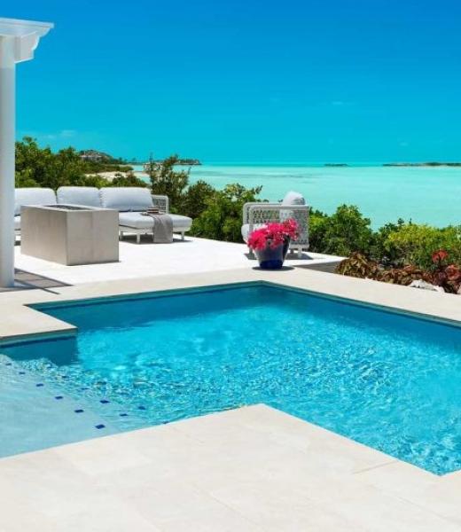 Sandy Shore Villa is a luxury beachfront villa surrounded by sparkling turquoise water on the beautiful island of Providenciales.
Nestled in serene Turtle Tail area of the island on the south side of Providenciales, Sandy Shore Villa offers complete privacy yet is barely a 10-minute drive to world-renowned Grace Bay Beach, and the restaurants and...